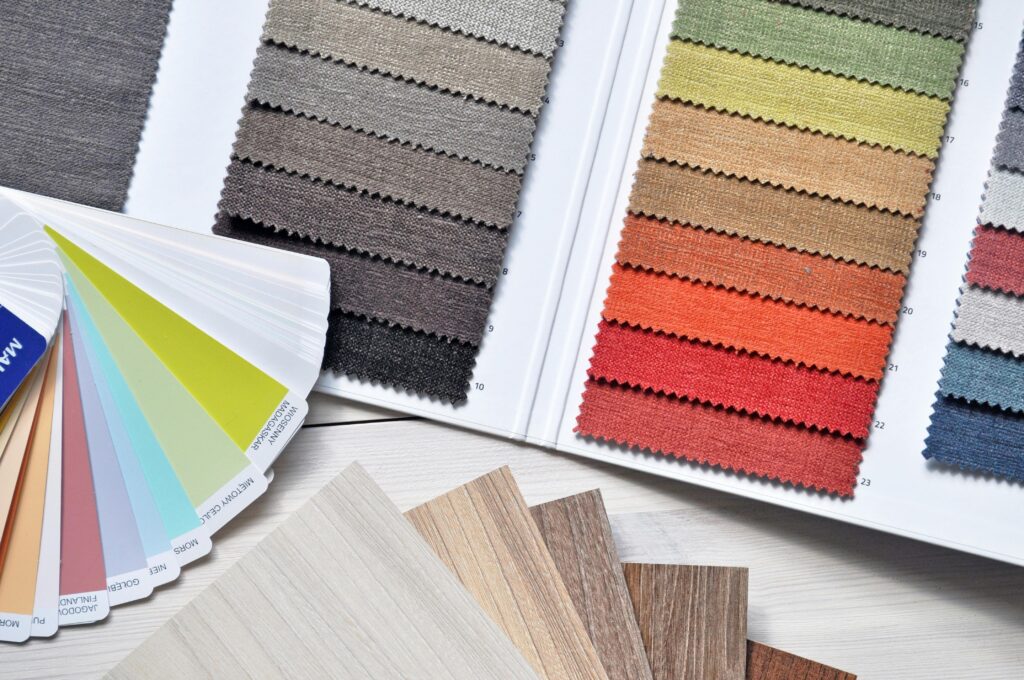 pexels-photo-276267-276267 Colorful fabric and paint swatches laid out for design inspiration and material selection.